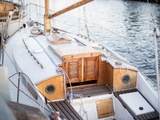 Woman on Yacht Holding a Sail at The Ocean